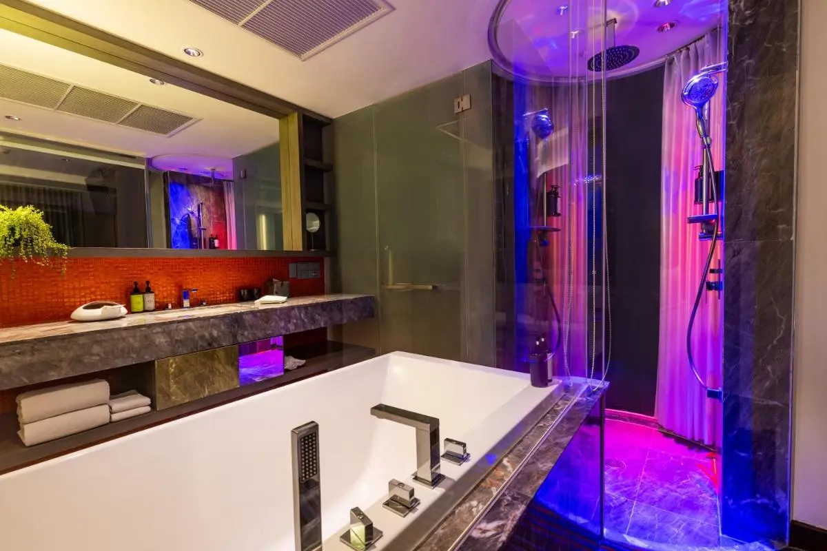 LiT BANGKOK Hotel Modern Bathroom Design with Bathtub and Ambient Shower Lighting in Pathumwan