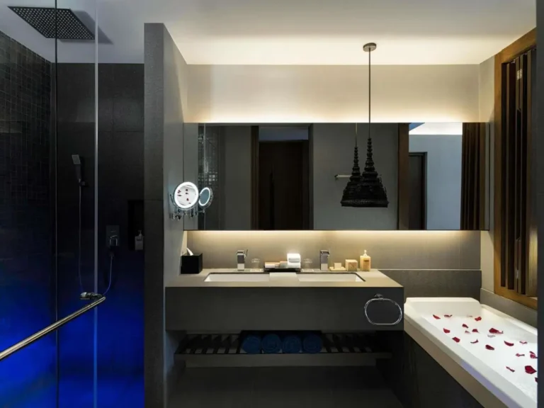 Modern Bathroom Featuring Double Vanity, Glass Shower, and Rose Petal Bathtub in Patong Beach