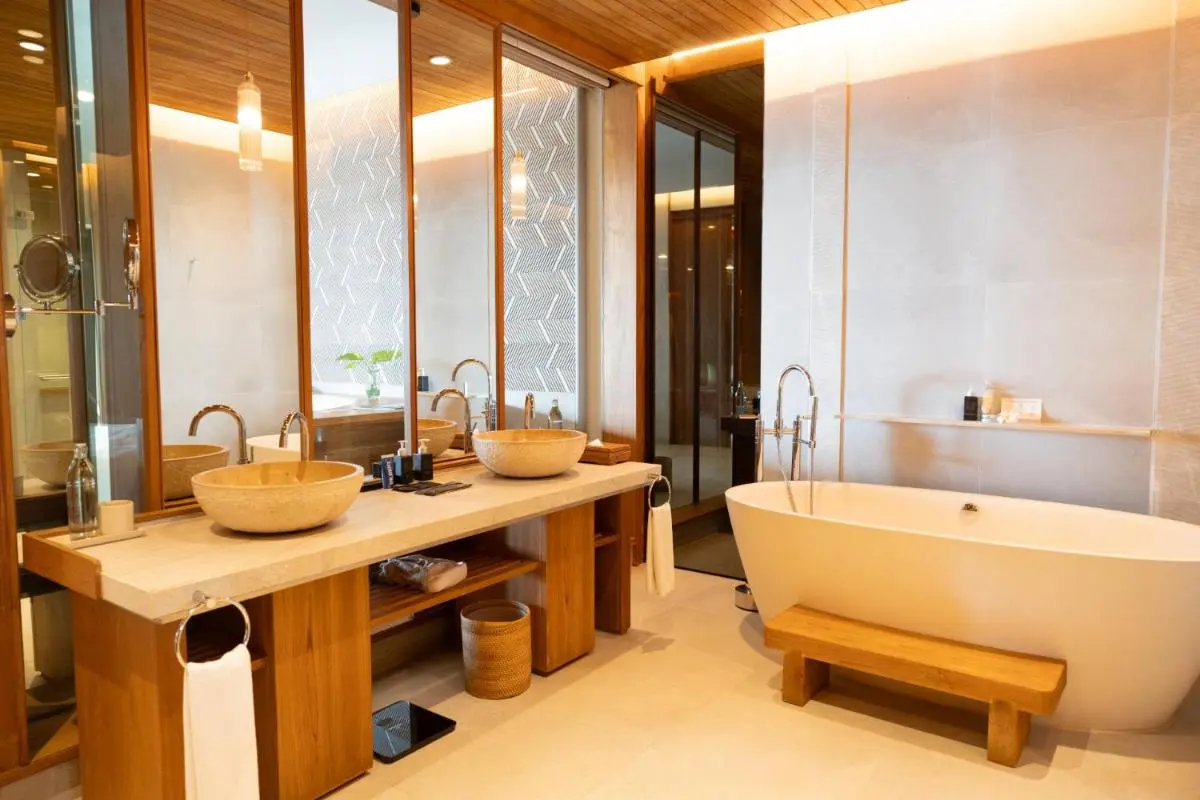 Panwa Beach Modern Bathroom Featuring Freestanding Bathtub and Double Stone Vessel Sinks