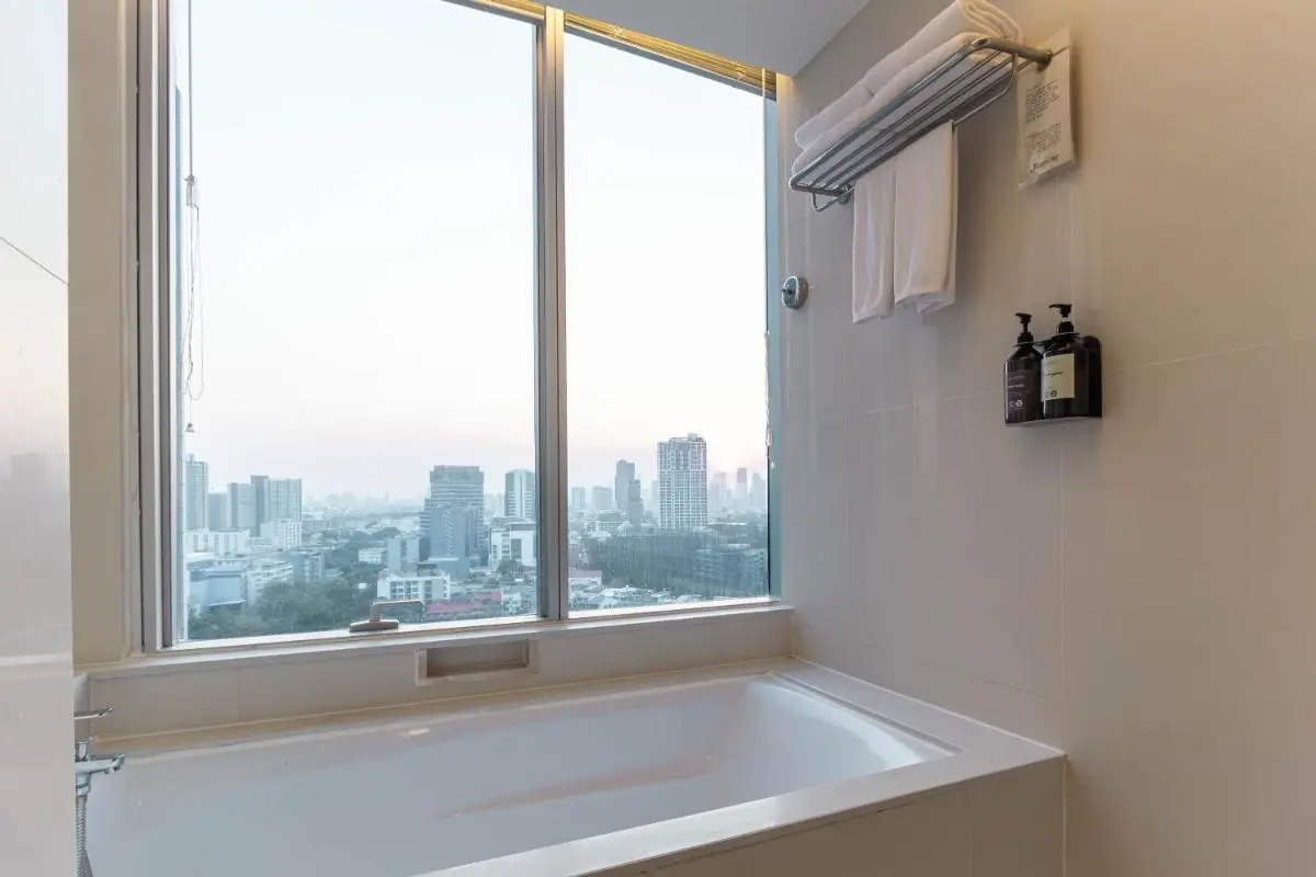 Modern Bathroom with Built-In Bathtub and City View in Wattana Bangkok