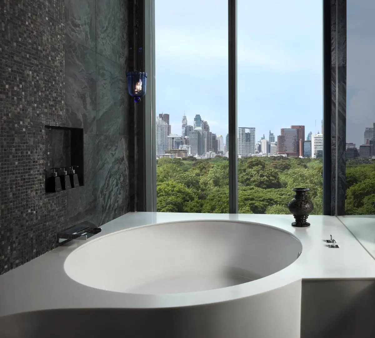 Modern Bathroom with Circular Bathtub and City View in Bang Rak Bangkok