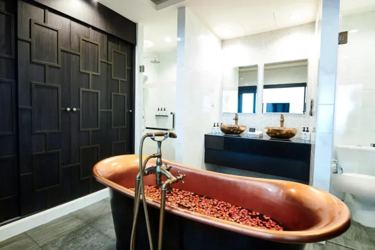 Modern Bathroom with Copper Bathtub and Double Sink Vanity in Phra Nakhon