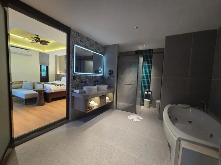 Modern Bathroom with Corner Jacuzzi Tub and Dual Vessel Sinks in Thalang