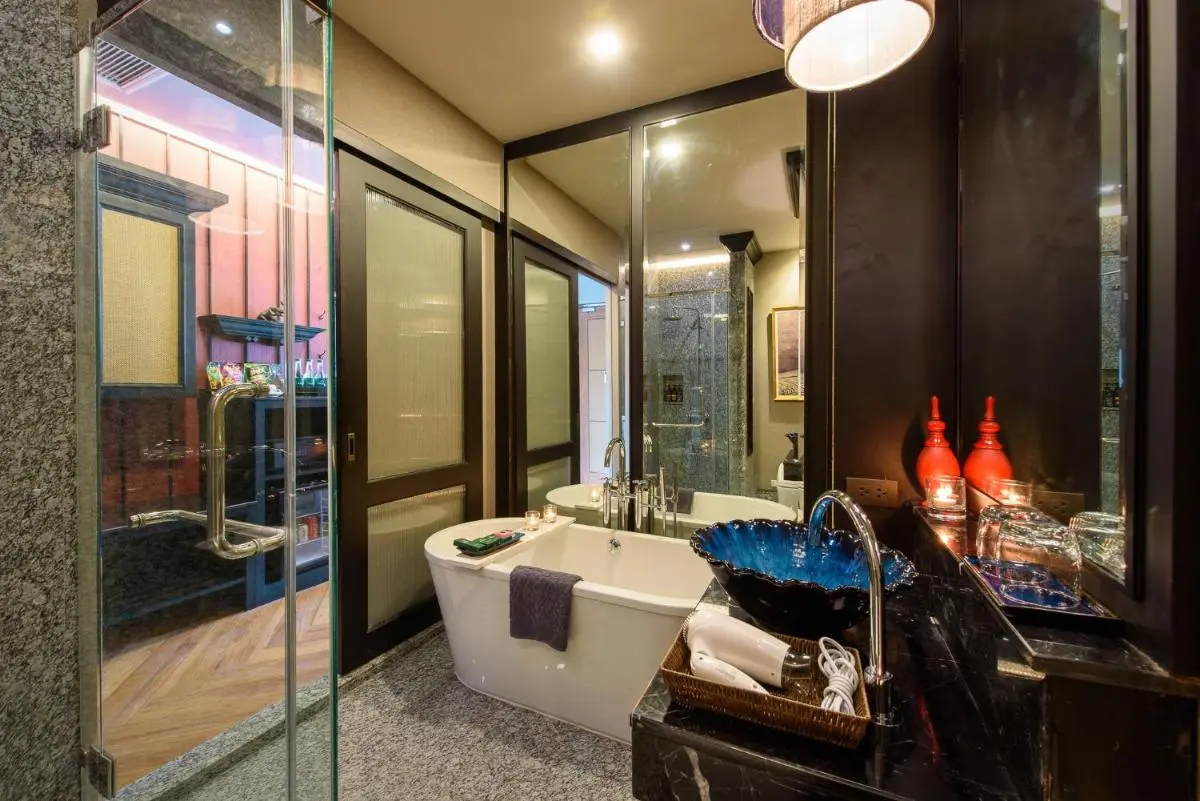 Modern Bathroom with Freestanding Bathtub and Blue Vessel Sink in Phra Sing Chiang Mai
