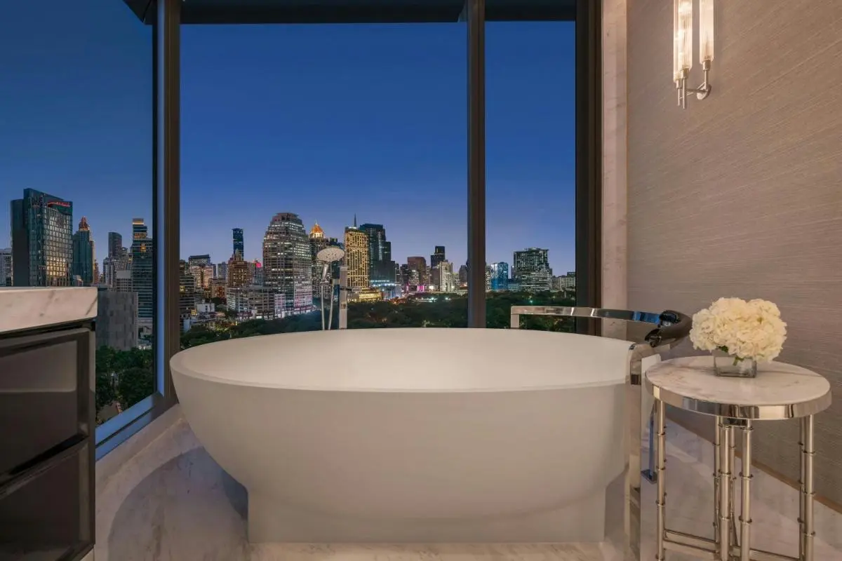 The Ritz-Carlton, Bangkok Modern Bathroom with Freestanding Bathtub and City Skyline View in Pathumwan Bangkok