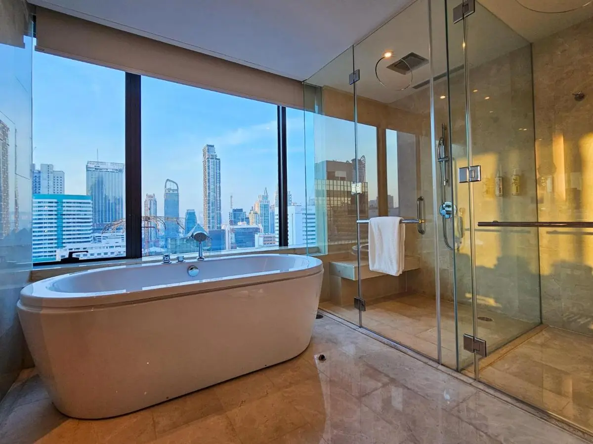 Renaissance Bangkok Ratchaprasong Hotel by Marriott Modern Bathroom with Freestanding Bathtub and City Skyline View in Pathumwan Bangkok