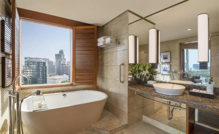 Modern Bathroom with Freestanding Bathtub and City View in Pathumwan Bangkok