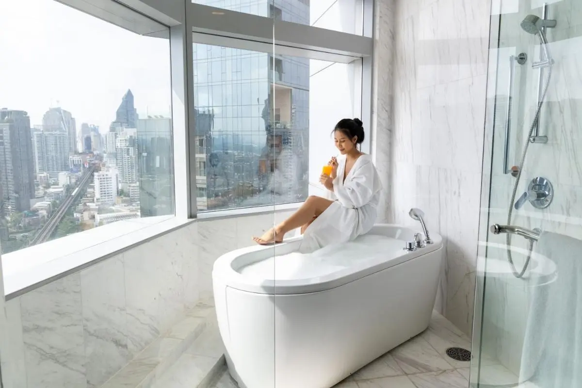 Modern Bathroom with Freestanding Bathtub and City View in Wattana Bangkok