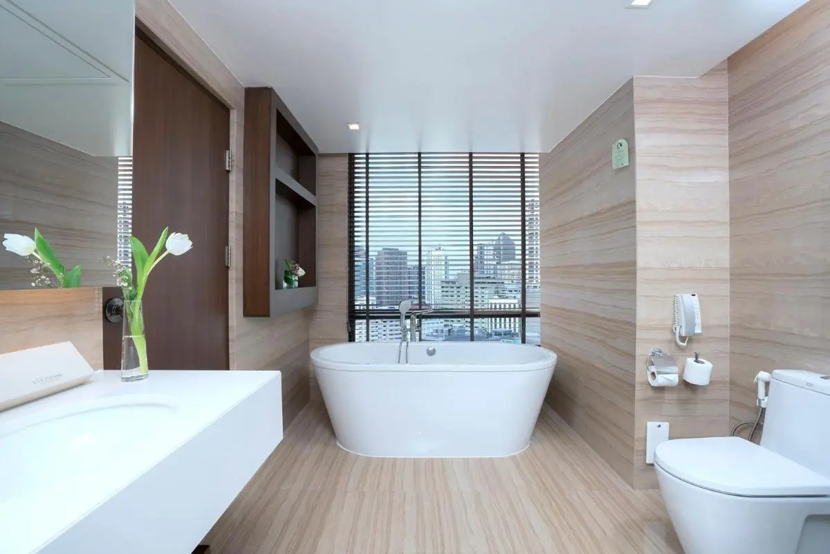 Modern Bathroom with Freestanding Bathtub and Cityscape View in Khlong Toei Bangkok