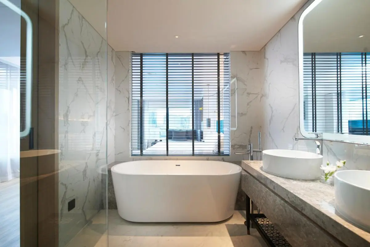 Amari Bangkok Modern Bathroom with Freestanding Bathtub and Dual Sinks in Ratchathewi, Bangkok