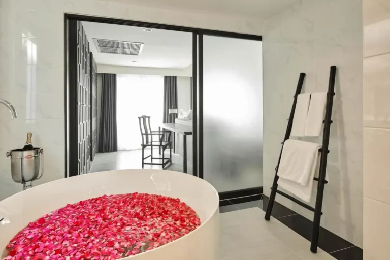 Modern Bathroom with Freestanding Bathtub and Flower Petals in Phra Nakhon