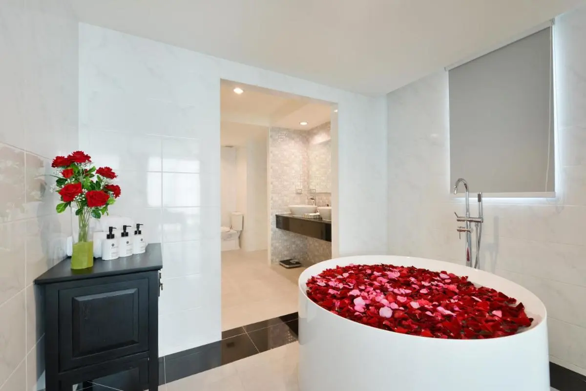 Modern Bathroom with Freestanding Bathtub and Rose Petals in Phra Nakhon, Bangkok