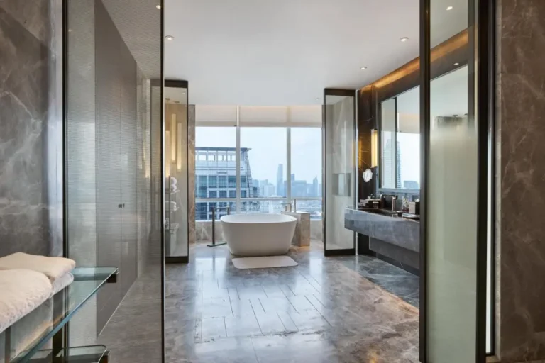 Modern Bathroom with Freestanding Bathtub and Urban Skyline View in Pathumwan Bangkok