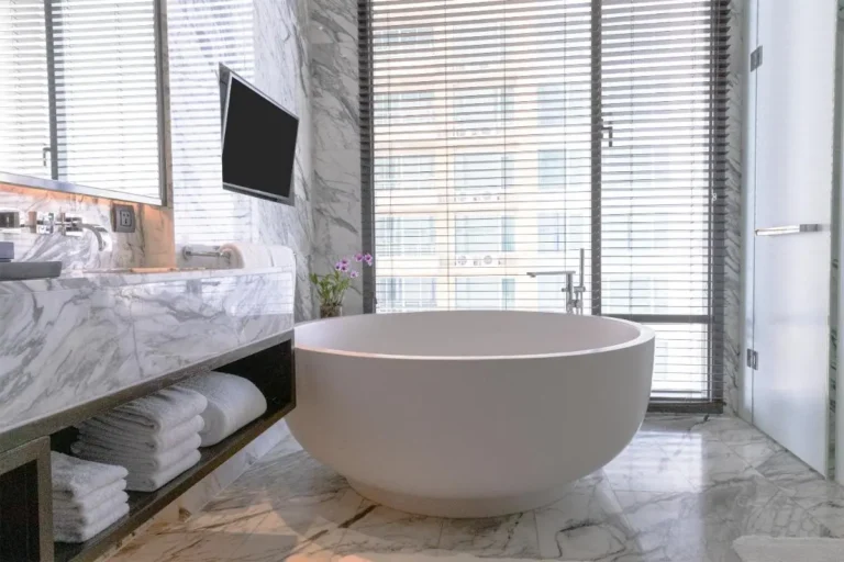 Modern Bathroom with Freestanding Bathtub and Urban View in Wattana Bangkok