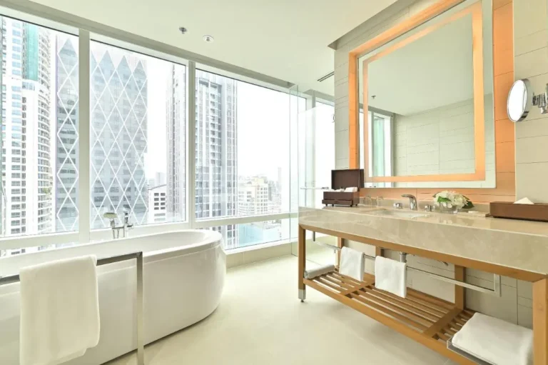 Modern Bathroom with Freestanding Bathtub and Urban Views in Sathorn Bangkok