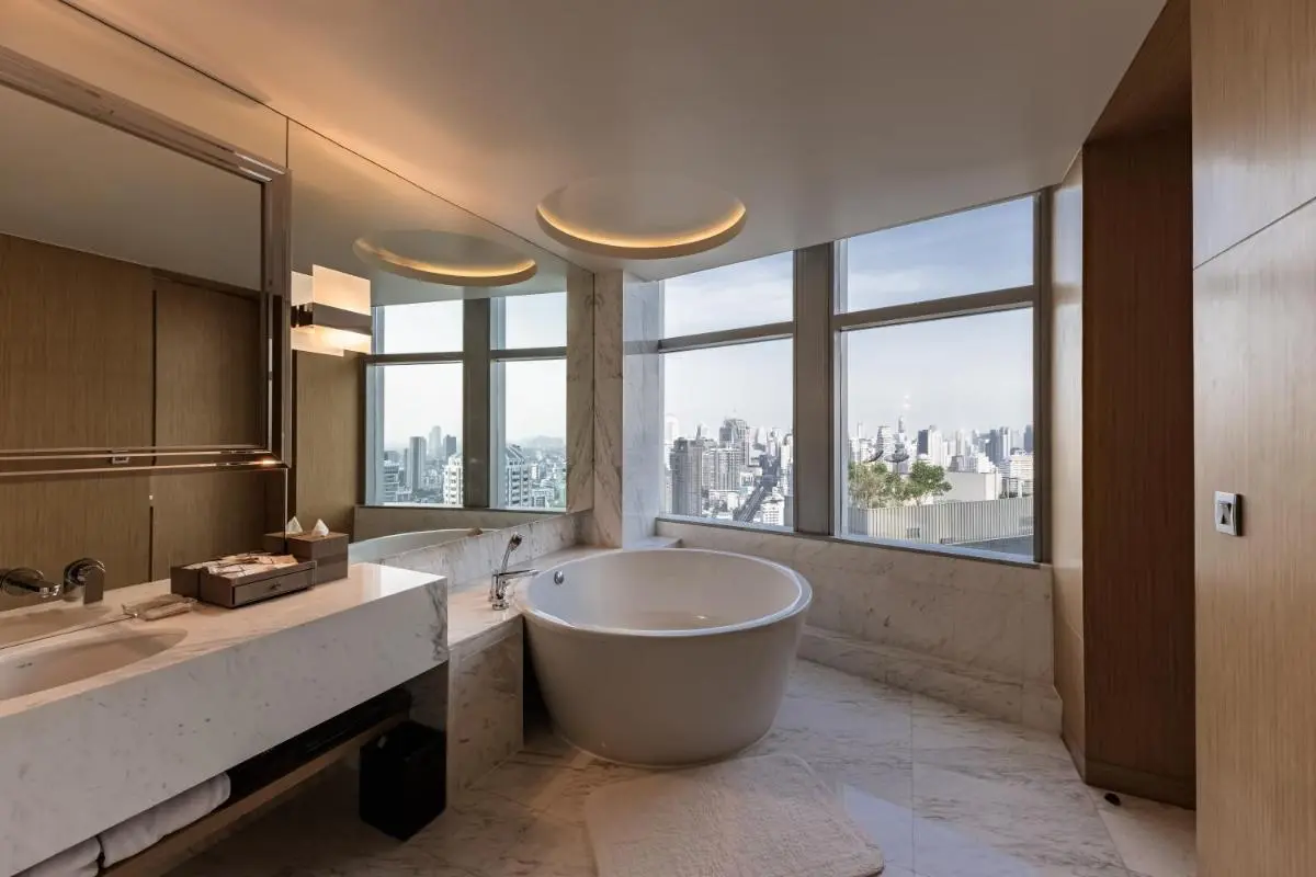 Modern Bathroom with Freestanding Circular Bathtub and City Views in Wattana Bangkok