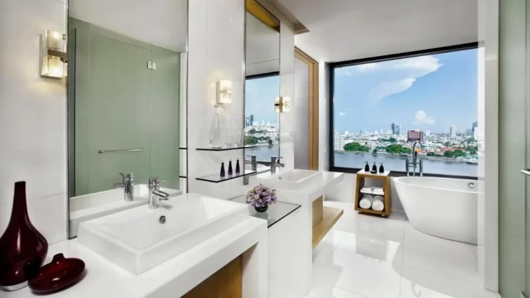 Modern Bathroom with Freestanding Tub and Cityscape View in Thonburi Area