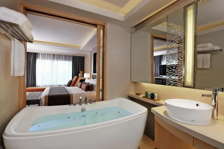 Modern Bathroom with Jacuzzi Tub and Bedroom View in Ratchathewi Area