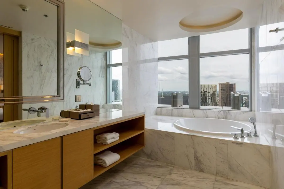 Bangkok Marriott Hotel Sukhumvit Modern Bathroom with Marble Bathtub and City Views in Wattana Bangkok
