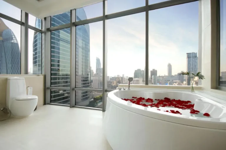 Modern Bathroom with Oval Bathtub and City Skyline View in Pathumwan Bangkok