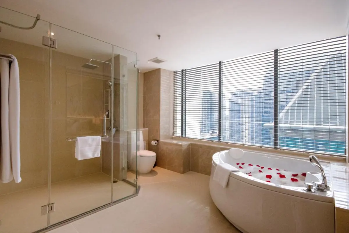 Modern Bathroom with Oval Bathtub and City View in Pathumwan Bangkok