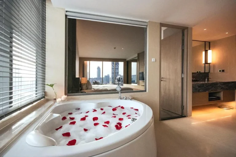 Modern Bathroom with Oval Soaking Tub and City View in Pathumwan Bangkok