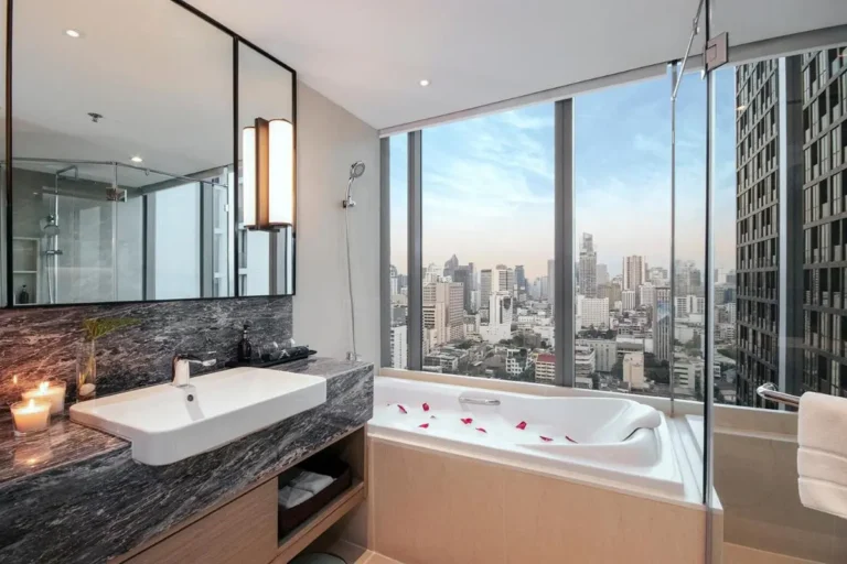 Modern Bathroom with Panoramic City View and Luxurious Bathtub in Pathumwan Bangkok