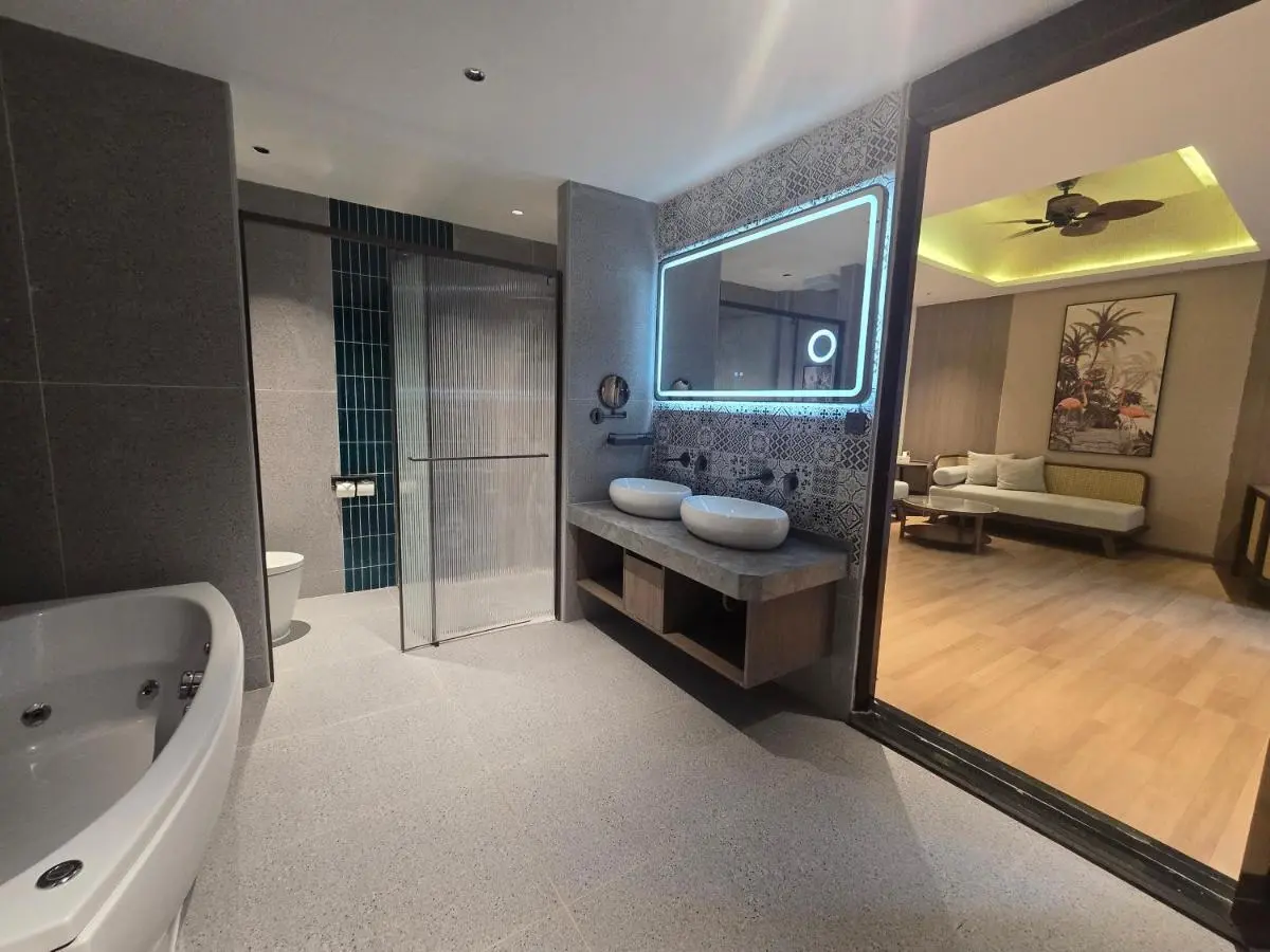 Modern Bathroom with Whirlpool Bathtub and Adjacent Living Area in Thalang