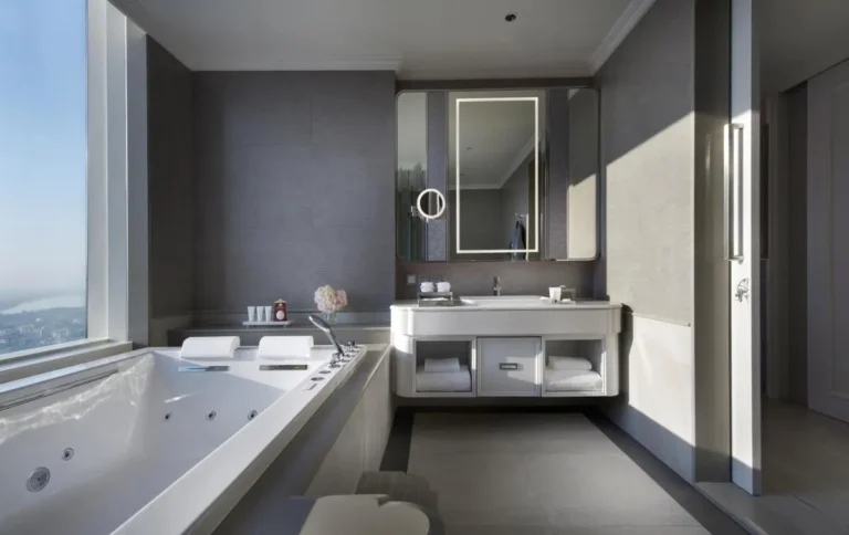 Modern Bathroom with Whirlpool Tub and City View in Sathorn High-Rise Modern Bathroom with Whirlpool Tub and City View in Sathorn High-Rise