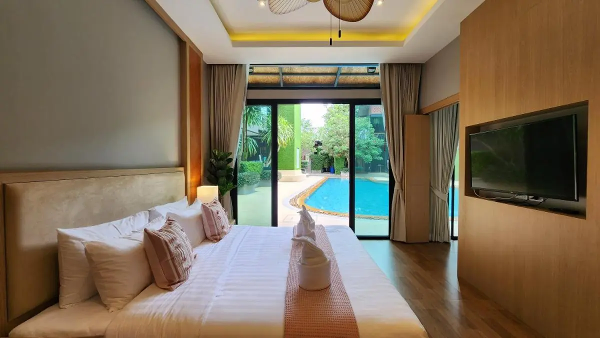 Modern Bedroom with Direct Access to Outdoor Swimming Pool and Natural Surroundings in Ban Bo Rae