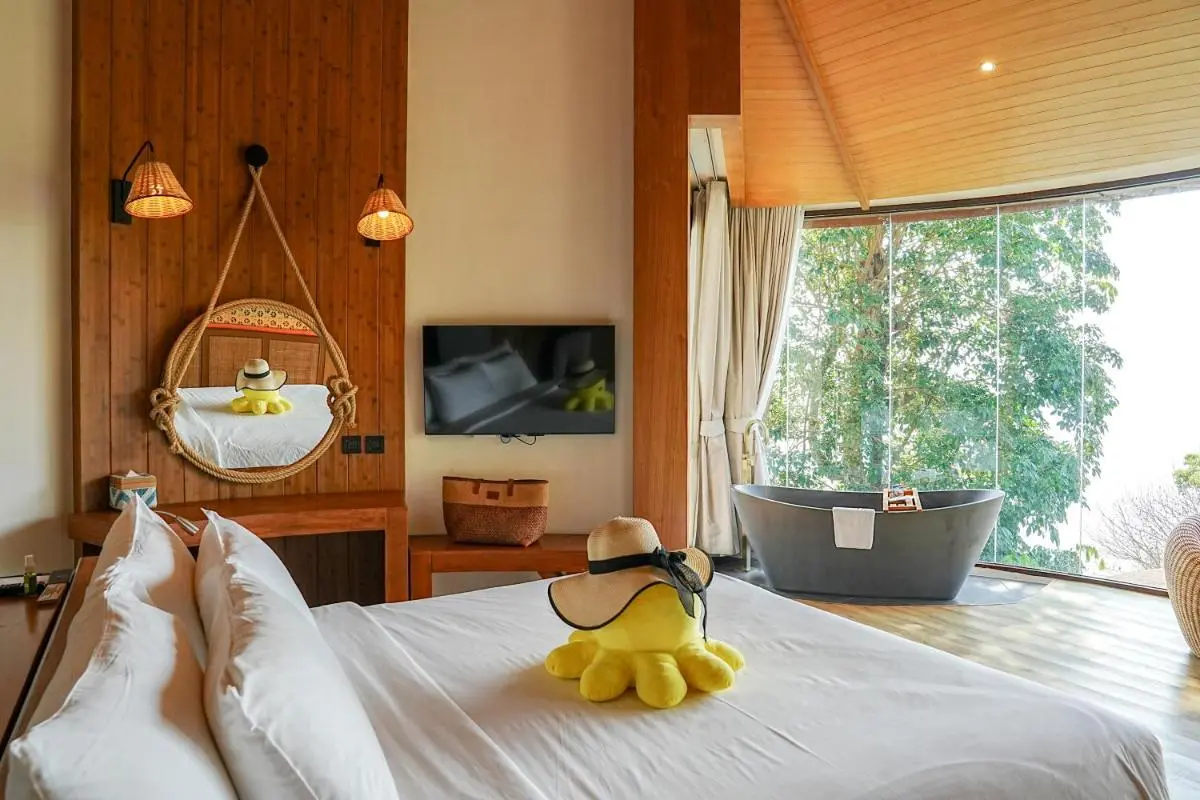 Modern Bedroom with Freestanding Bathtub and Natural Views in Phuket Town