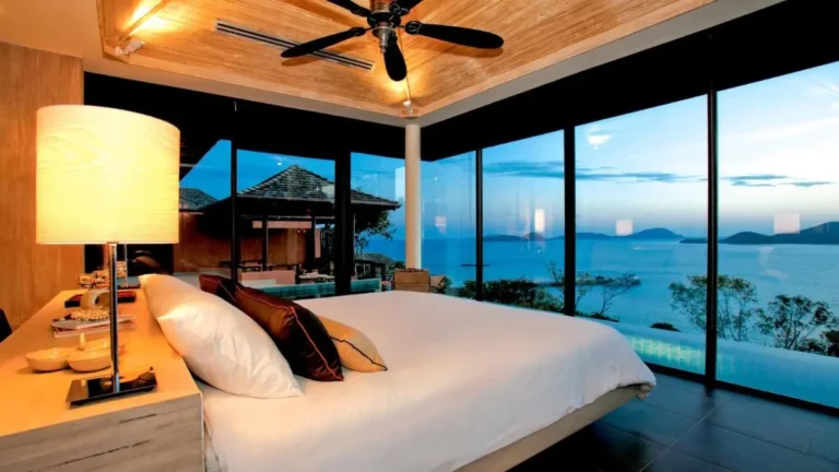 Modern Bedroom with Pool View and Scenic Waterfront at Panwa Beach