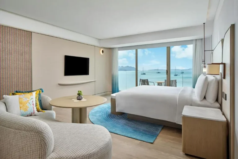 Modern Coastal Room with Balcony Overlooking Panwa Beach Waterfront and Sailboats
