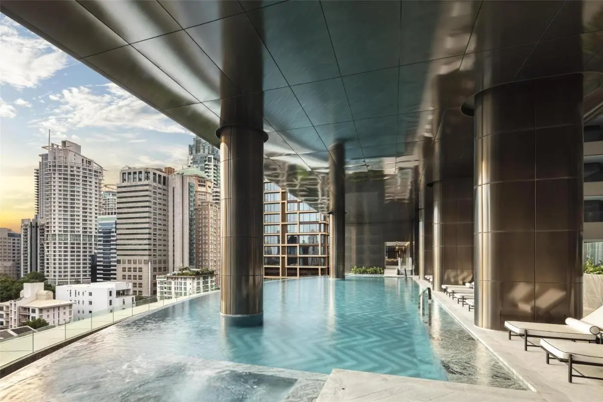 Modern Elevated Swimming Pool with City Views and Lounge Seating in Pathumwan Bangkok