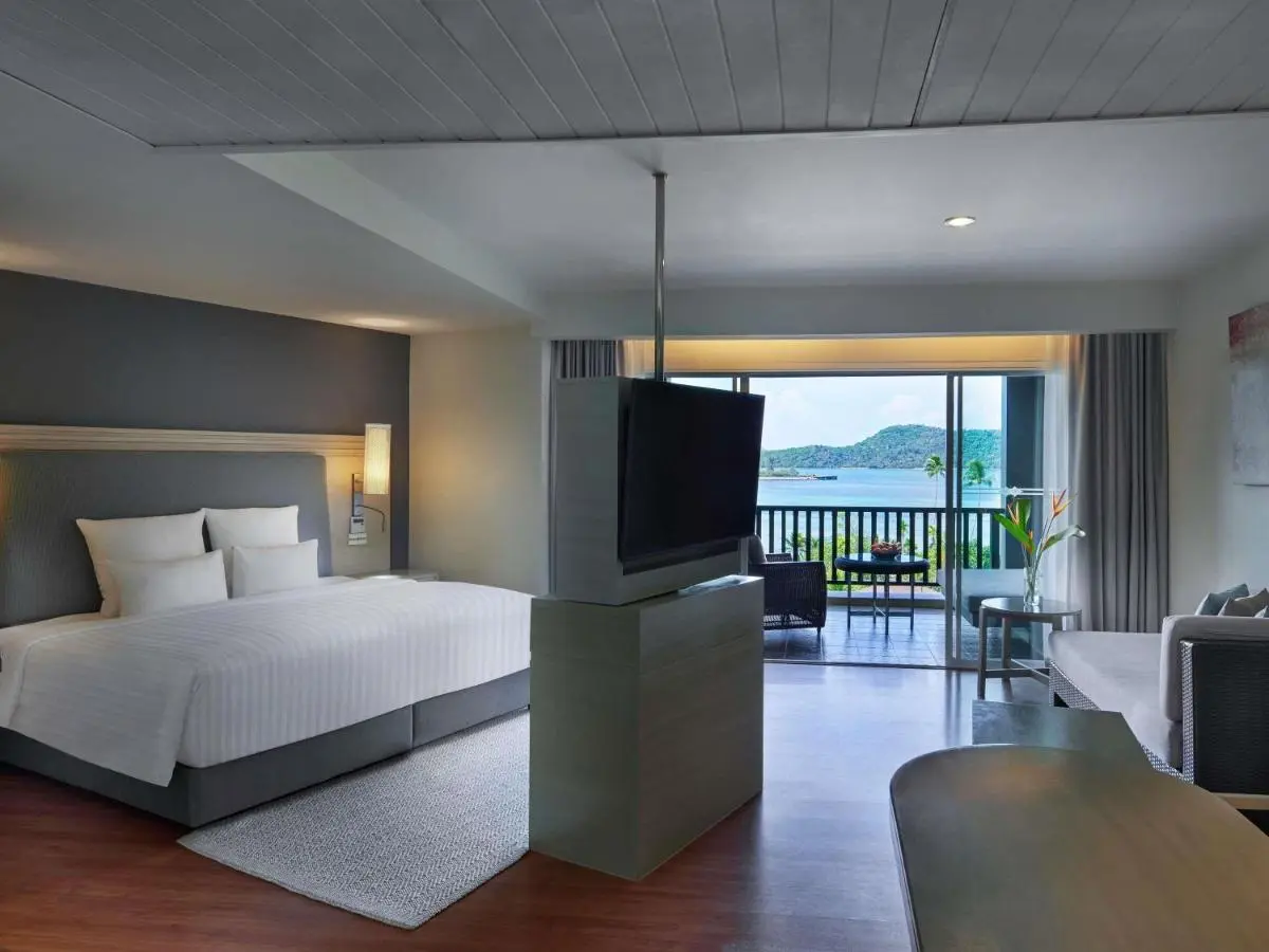 Phuket Province Modern Hotel Room with Balcony Overlooking Calm Waters at Panwa Beach