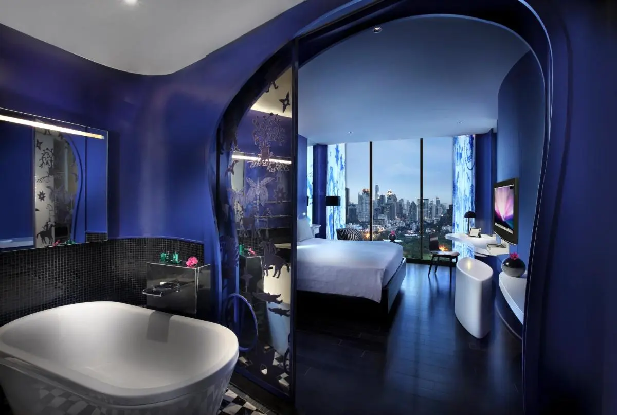 Modern Hotel Room with Freestanding Bathtub and City Skyline Views in Bang Rak