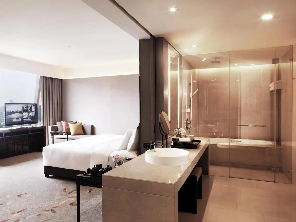 Modern Hotel Room with Glass-Enclosed Bathtub and Rainfall Shower in Pathumwan