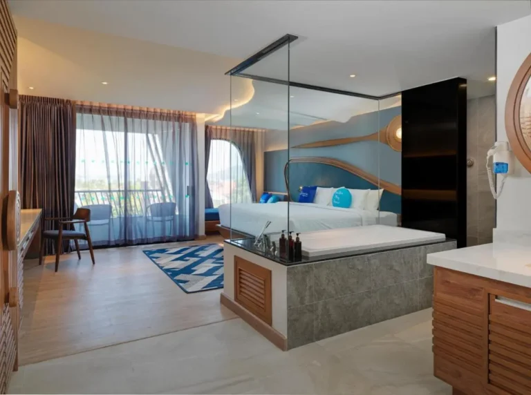 Modern Hotel Room with Integrated Bathtub and Scenic Outdoor Views in Phuket Town