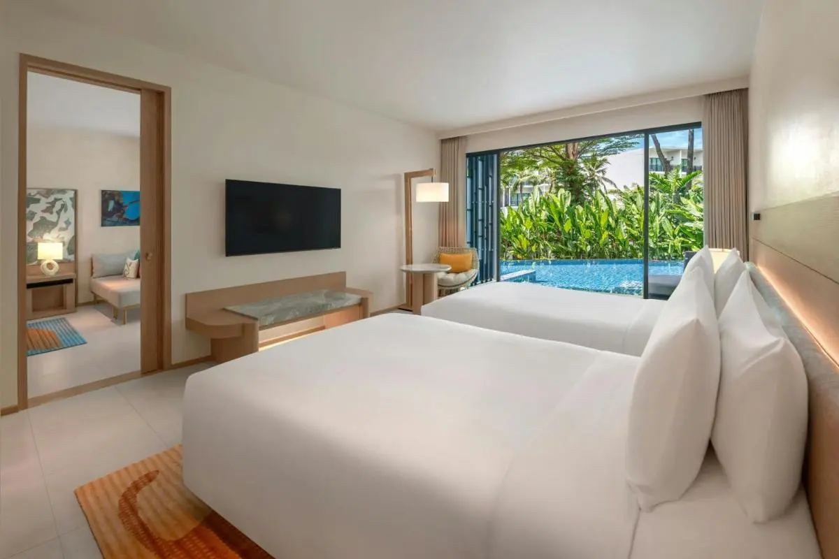 Modern Hotel Room with Outdoor Swimming Pool and Garden View at Mai Khao Beach