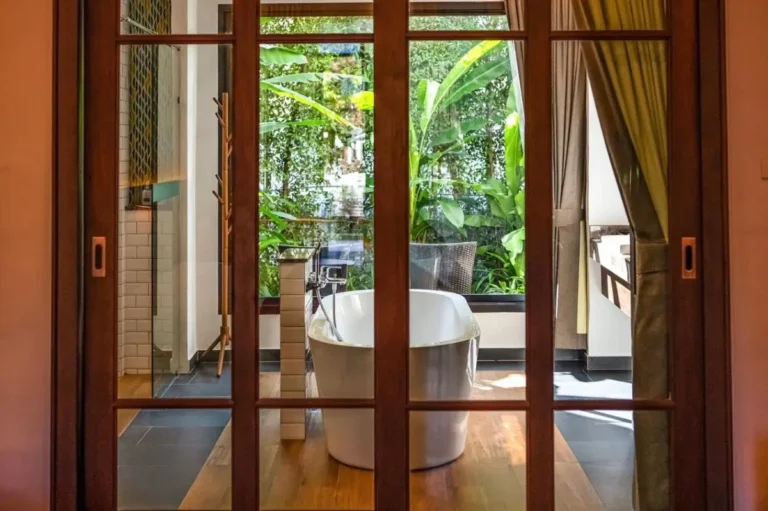 Modern Indoor Bathroom with Freestanding Bathtub and Natural Views in Chiang Mai