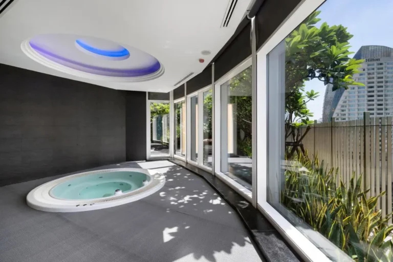 Modern Indoor Jacuzzi and Wellness Area with Natural Light in Wattana Bangkok