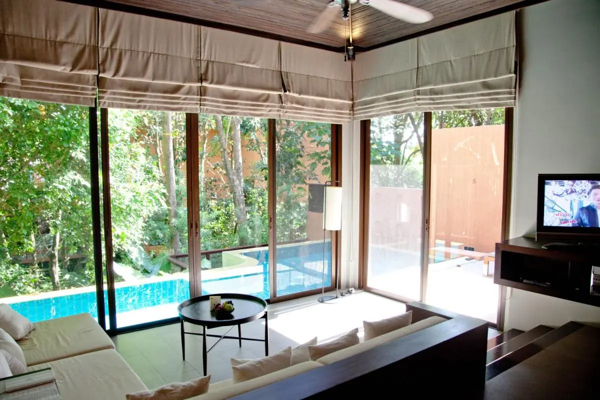Modern Indoor Living Space with Pool View and Natural Surroundings at Panwa Beach