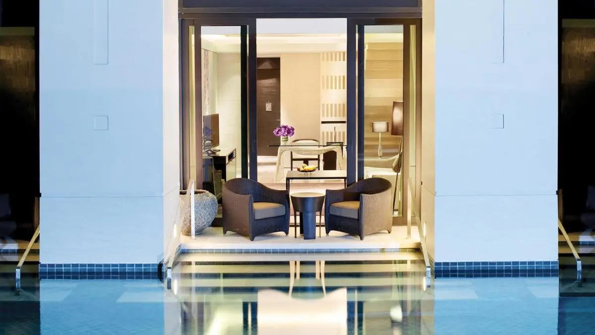 Modern Indoor-Outdoor Pool and Spa Room with Jacuzzi in Pathumwan Bangkok