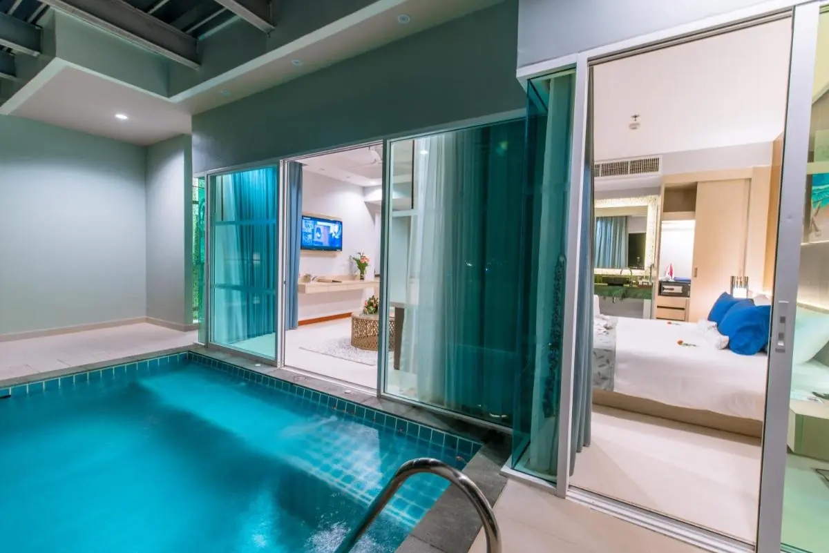 Modern Indoor Pool Area with Integrated Living and Bedroom Spaces in Patong Beach