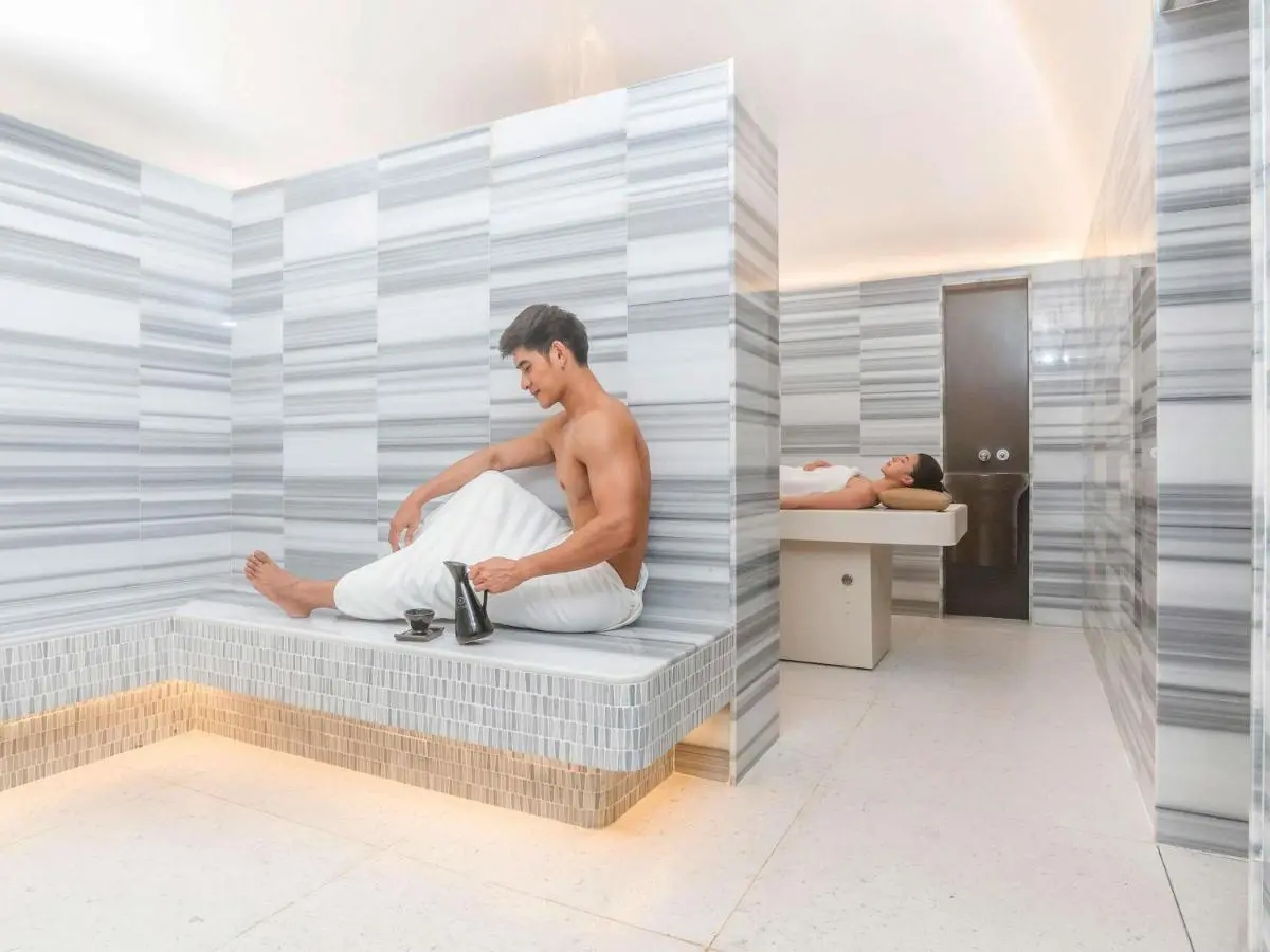 Modern Indoor Spa and Hydrotherapy Room with Tiled Benches in Ratchathewi Bangkok
