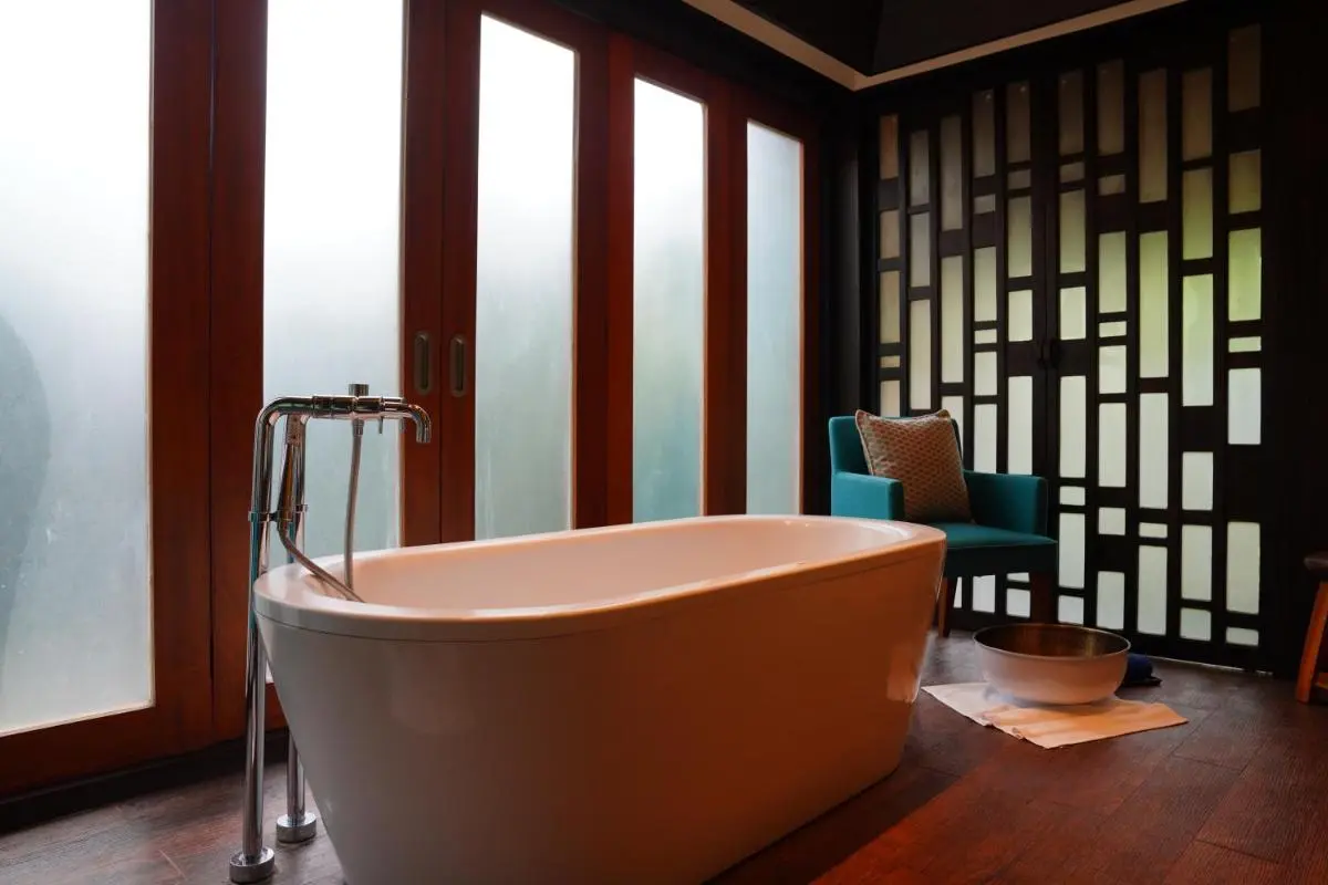 Modern Indoor Wellness Area with Freestanding Bathtub and Relaxation Features