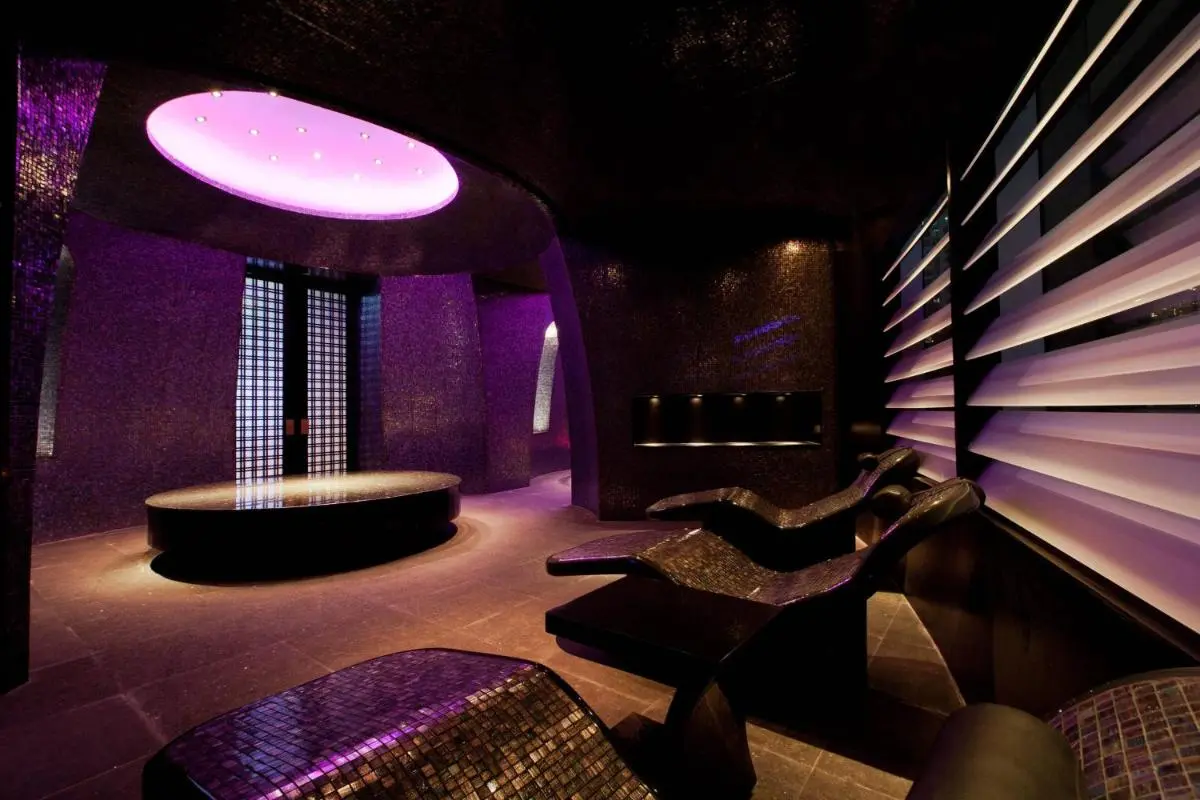 Modern Indoor Wellness Room with Purple Lighting and Mosaic Lounge Chairs in Bang Rak