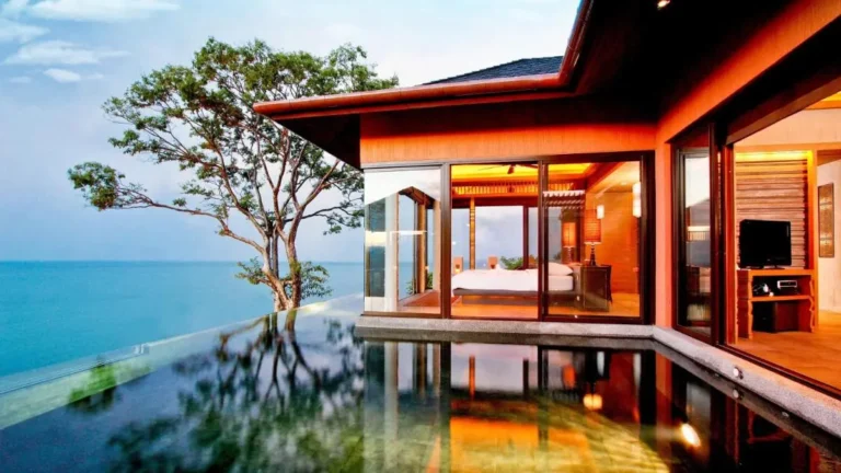 Modern Infinity Pool and Glass-Walled Bedroom Overlooking Panwa Beach Waters