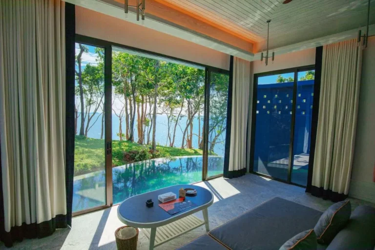 Modern Interior Space with Sliding Glass Doors and Pool at Panwa Beach
