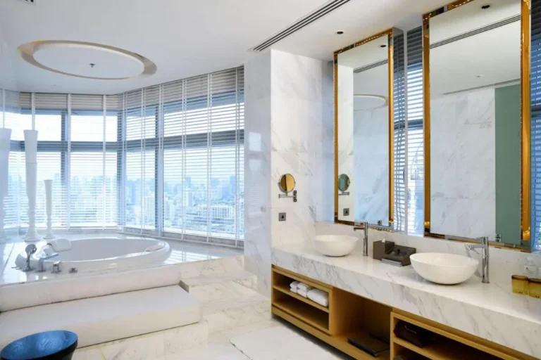 Modern Luxury Bathroom with Oval Bathtub and City Views in Wattana Bangkok